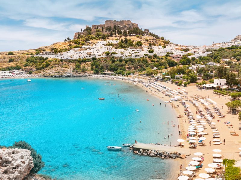 Idyllic Paradise landscape of the resort town of Lindos on the island of Rhodes, Greece. The concept of holidays in the tropics and historical cities